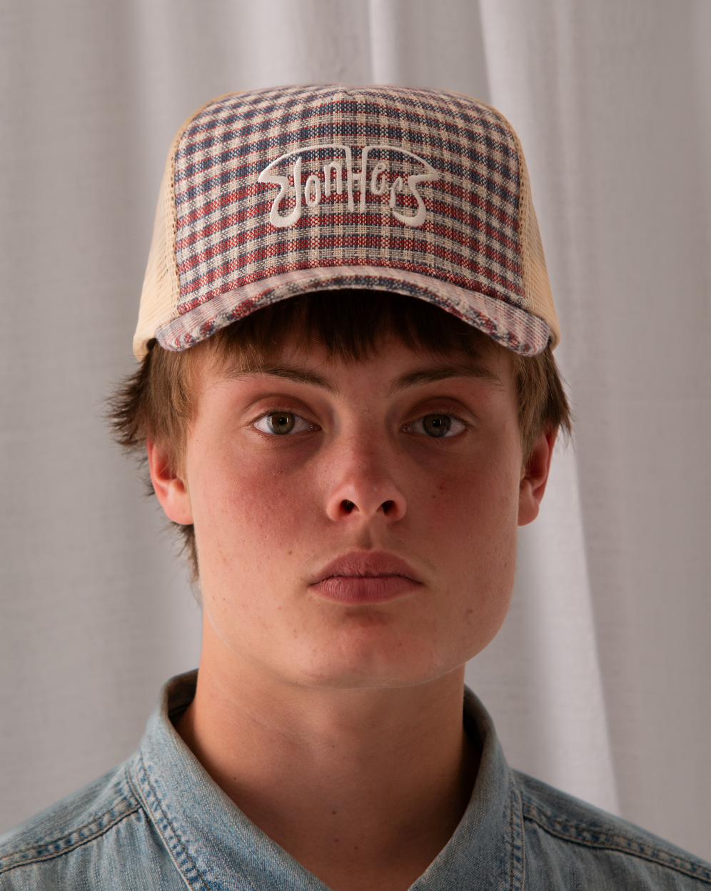 Americana Plaid Trucker Hat — lifestyle shot